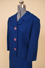 Load image into Gallery viewer, Vintage 1950s boxy cropped blazer is shown from the side. This wool blazer has two pockets at the hips. 

