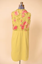 Load image into Gallery viewer, Vintage green and pink floral linen midi dress is shown from the back. This dress has shell buttons up the back. 
