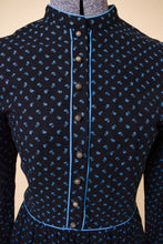 Load image into Gallery viewer, Vintage cotton calico floral print blue prairie dress by Lanz of Salzburg is shown in close up. This seventies midi frock has textured silver buttons down the neckline.
