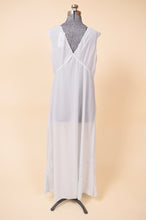 Load image into Gallery viewer, Vintage powder blue sixties maxi length sheer dress is shown from the back. 
