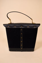 Load image into Gallery viewer, Vintage black Enid Collins bucket bag is shown from the back. This bag has a top handle.

