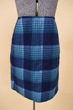 Load image into Gallery viewer, Vintage 70s blue wool plaid mini skirt is shown from the front. This blue plaid mini is handmade. 
