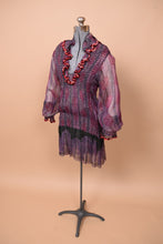 Load image into Gallery viewer, The dress is angled to the left. The sleeves are puffed.