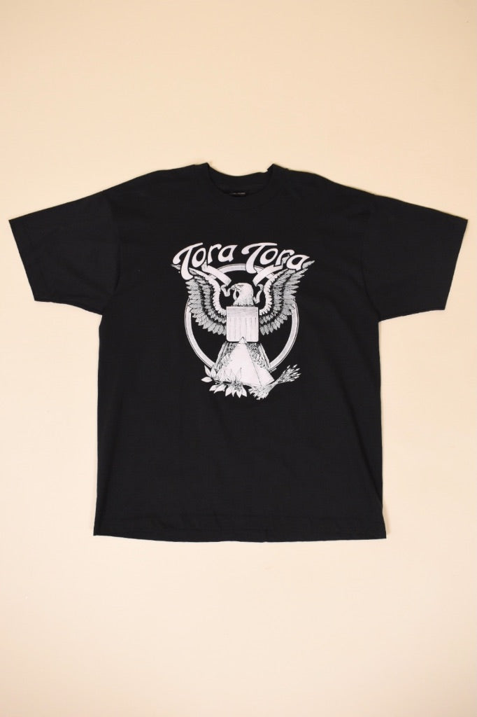 Vintage 1980's black Tora Tora graphic tee shirt is shown from the front. This tee shirt has an eagle graphic on the front. 