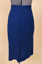 Load image into Gallery viewer, Vintage fifties cobalt blue wool pencil skirt is shown from the back. 
