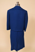 Load image into Gallery viewer, Vintage fifties Mad Men two piece navy wool office skirt set is shown from the back. This suit set has a collared boxy blazer. 

