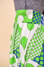 Load image into Gallery viewer, Vintage 60&#39;s white, blue, and green clown core polka dot maxi is shown in close up. This skirt has a large white plastic zipper. 
