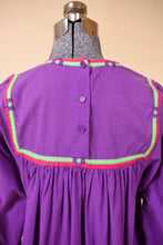 Load image into Gallery viewer, Vintage purple cotton midi length tunic dress is shown in close up. This dress has hot pink and green trim.
