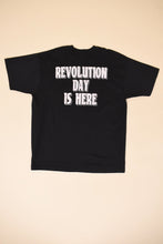 Load image into Gallery viewer, Vintage 80&#39;s black graphic tee is shown from the back. This tee shirt reads Revolution Day is Here on the back in white. 

