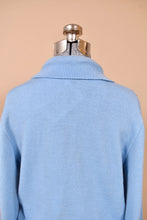 Load image into Gallery viewer, Vintage baby blue wool sweater is shown in close up. This sweater has a cute foldover collar. 
