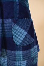 Load image into Gallery viewer, Vintage 70s two piece wool skirt set is shown in close up. This vest has pockets on the side.
