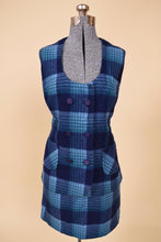 Load image into Gallery viewer, Vintage 1970&#39;s blue and navy plaid skirt and vest set is shown from the front. This vest is double breasted with a low cut neckline.
