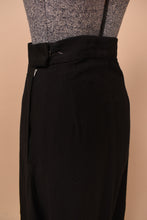 Load image into Gallery viewer, Vintage black cotton sixties maxi skirt is shown in close up. This skirt has a zipper closure.