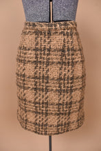 Load image into Gallery viewer, Vintage 1960&#39;s fuzzy tweed tan skirt set is shown in close up. This wool mini skirt has a tan and brown plaid pattern. 
