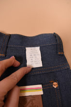 Load image into Gallery viewer, A hand holds the back right label.