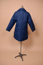 Load image into Gallery viewer, Vintage long puffy quilted navy blue coat is shown from the back.