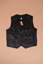 Load image into Gallery viewer, Vintage 1990's black leather vest is shown from the front. This vest has an American flag on the back.