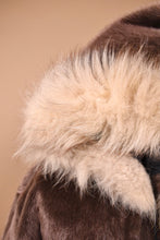 Load image into Gallery viewer, Vintage 1960s faux fur cropped jacket by Ulla is shown in close up. This jacket has a hood with a fuzzy fur lining.
