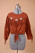 Load image into Gallery viewer, Vintage rust brown western style cotton cropped top is shown from the front. This shirt has fringe on the sleeves and across the chest.
