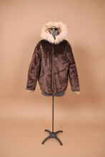 Load image into Gallery viewer, Vintage brown sixties teddy coat is shown from the front. This jacket has a white faux fur lining.
