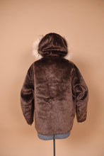 Load image into Gallery viewer, Vintage chocolate brown 1960&#39;s faux fur fuzzy teddy coat is shown from the back. This coat has a hood.

