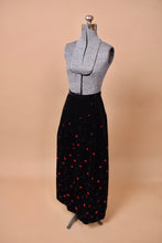 Load image into Gallery viewer, The skirt is angled on the mannequin.