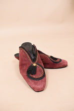 Load image into Gallery viewer, Red suede mules are shown from the front. These mules have black embroidery with gold details.
