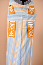 Load image into Gallery viewer, Vintage handmade artsy striped dress is shown from the side. This dress has an orange and white embroidered ribbon.

