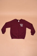 Load image into Gallery viewer, The sweatshirt lies flat. The sleeves have cuffs.