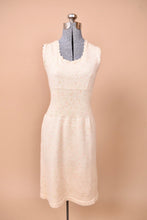 Load image into Gallery viewer, The dress is sleeveless with scalloped detailing.
