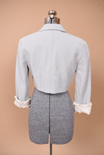 Load image into Gallery viewer, Vintage Y2K sky blue cropped blazer by Zac Posed is shown from the back. This jacket has a sheer scrunched white textured detail at the hem of the cuffs.
