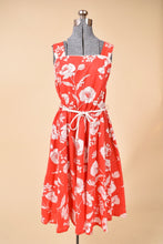 Load image into Gallery viewer, 1970&#39;s red and white floral dress is shown from the front. The dress has wide straps.
