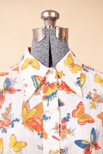 Load image into Gallery viewer, Closeup of the collar of 1970&#39;s butterfly shirt. The shirt has a pointed large collar.
