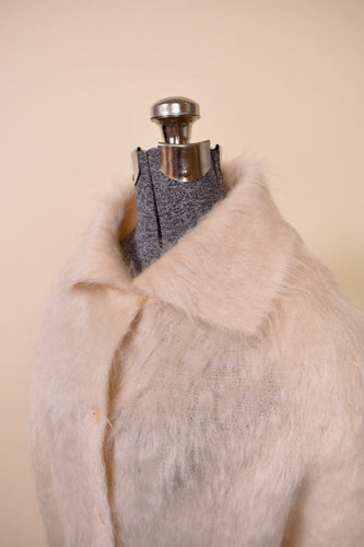 Suede duster vest is shown from the front. The vest is very long.