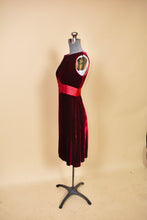 Load image into Gallery viewer, Label of Versace skirt is shown up close. The label reads &quot;Versace Jeans Couture.&quot;
