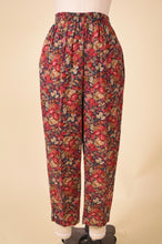 Load image into Gallery viewer, Laura Ashley floral pants are shown from the back. The pants have an elastic waist.
