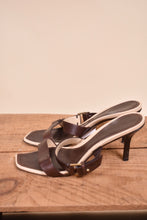 Load image into Gallery viewer, The designer Gucci heels are shown from the side. The heels are brown.
