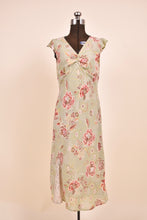 Load image into Gallery viewer, 2000s vintage dress is shown from the front. The dress is light green.
