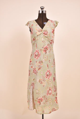 2000s vintage dress is shown from the front. The dress is light green.