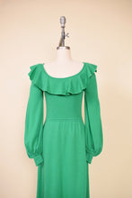 Load image into Gallery viewer, Y2K skater style skirt is shown from the side. The skirt has bronze details.
