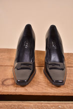 Load image into Gallery viewer, Gucci vintage heels are shown from the front. The heels are black.
