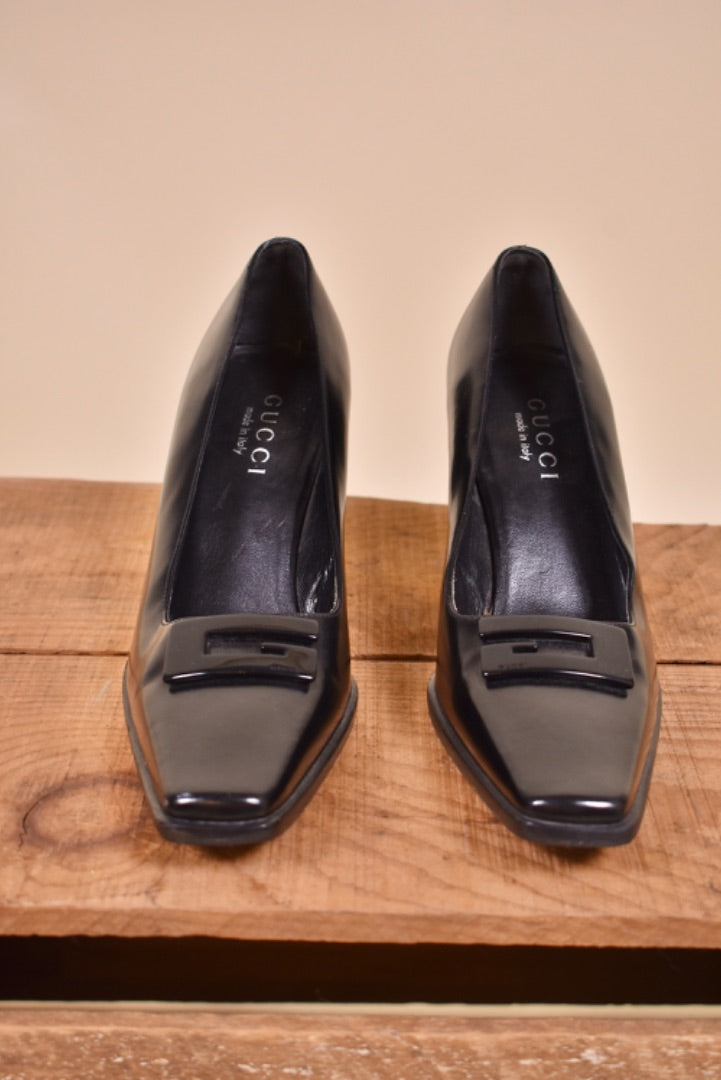 Gucci vintage heels are shown from the front. The heels are black.