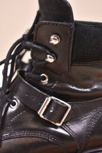 Load image into Gallery viewer, 2000s All Saints black boots are shown close up. The shoes lace up.
