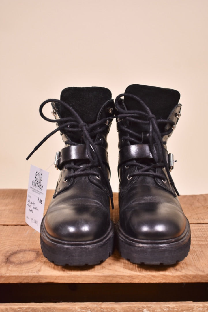 2000s vintage combat boots are shown from the front. The shoes are ankle length.