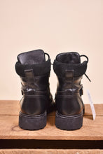 Load image into Gallery viewer, Vintage All Saints boots are shown from the back. The shoes have a thick platform.
