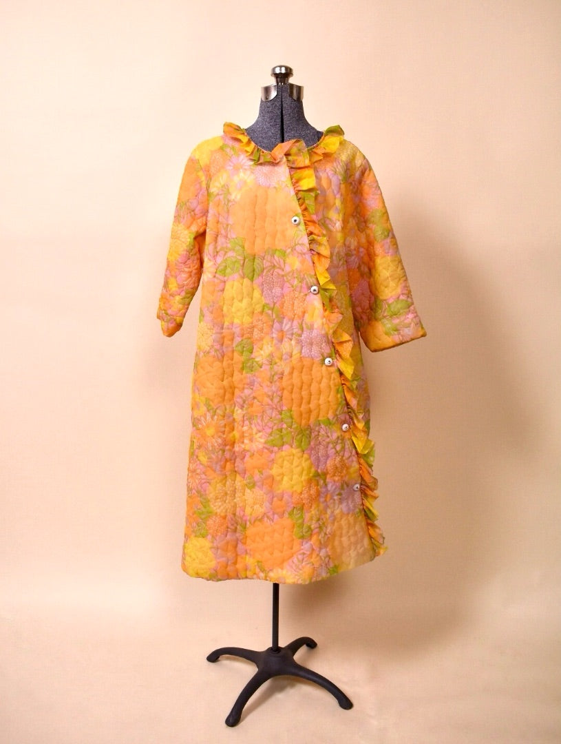 50s/60s Orange, Pink, and Yellow quilted floral long bed jacket from the front 