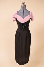Load image into Gallery viewer, Black and pink dress is shown from the front. The dress is fitted.
