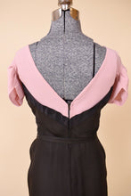 Load image into Gallery viewer, Back of the black and pink dress is shown up close. The back features a v-neckline.
