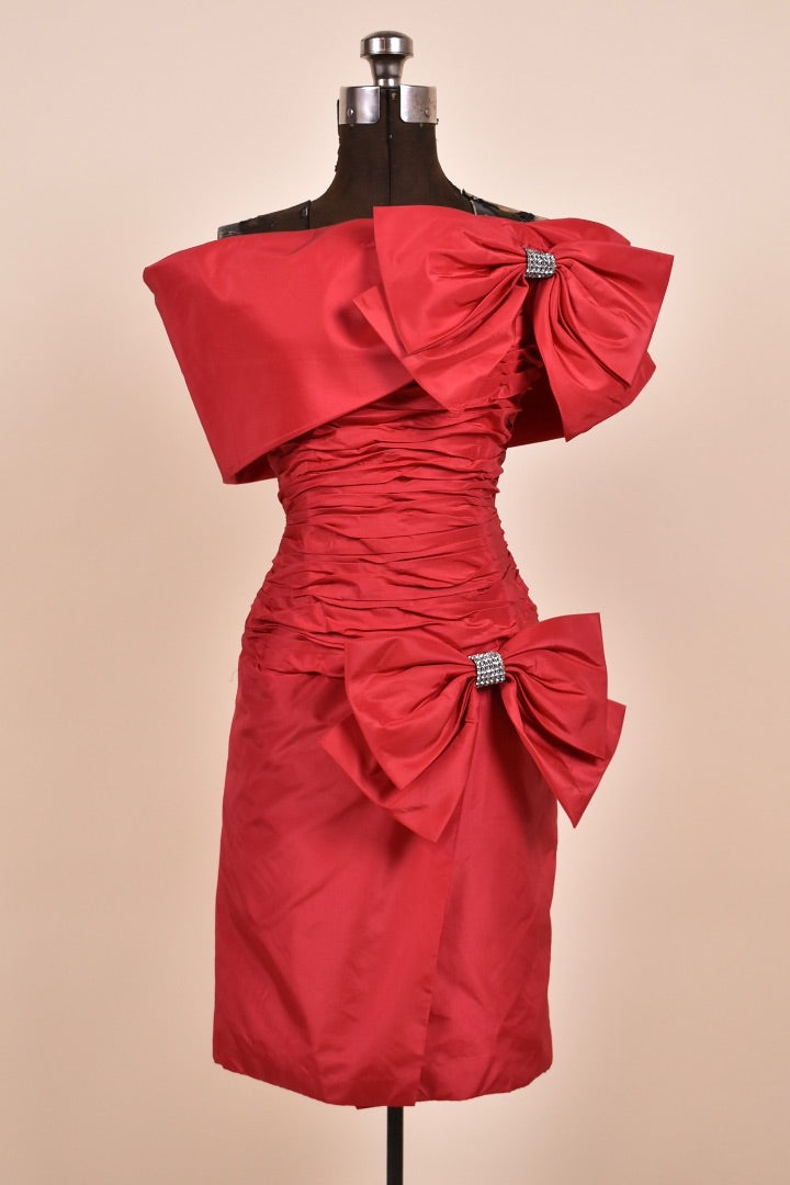 Red 80s ruched off shoulder cocktail dress with bows shown from the front