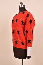 Load image into Gallery viewer, Red Shooting Star Print Sweater as shown from the side
